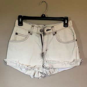 Bleach stained distressed jean shorts